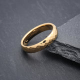 Elegant 4mm unique wedding ring for women in gold tungsten photographed on slate