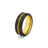 black beveled tungsten wedding band with a gold groove and sleeve