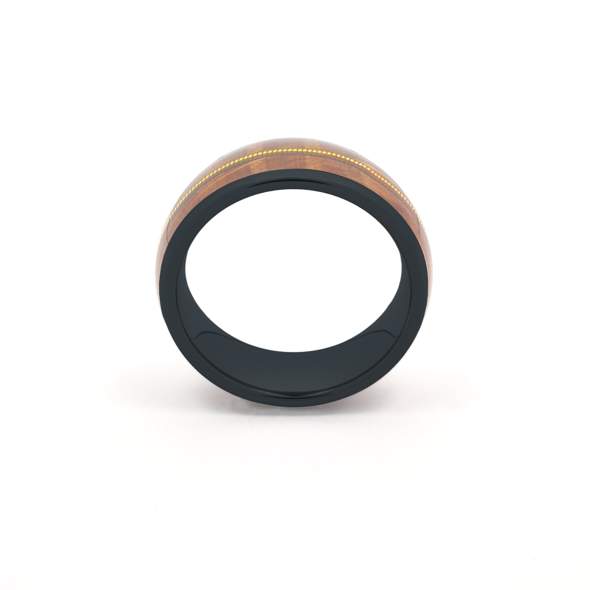 black tungsten ring featuring a recycled guitar wood and string inlay, standing upright