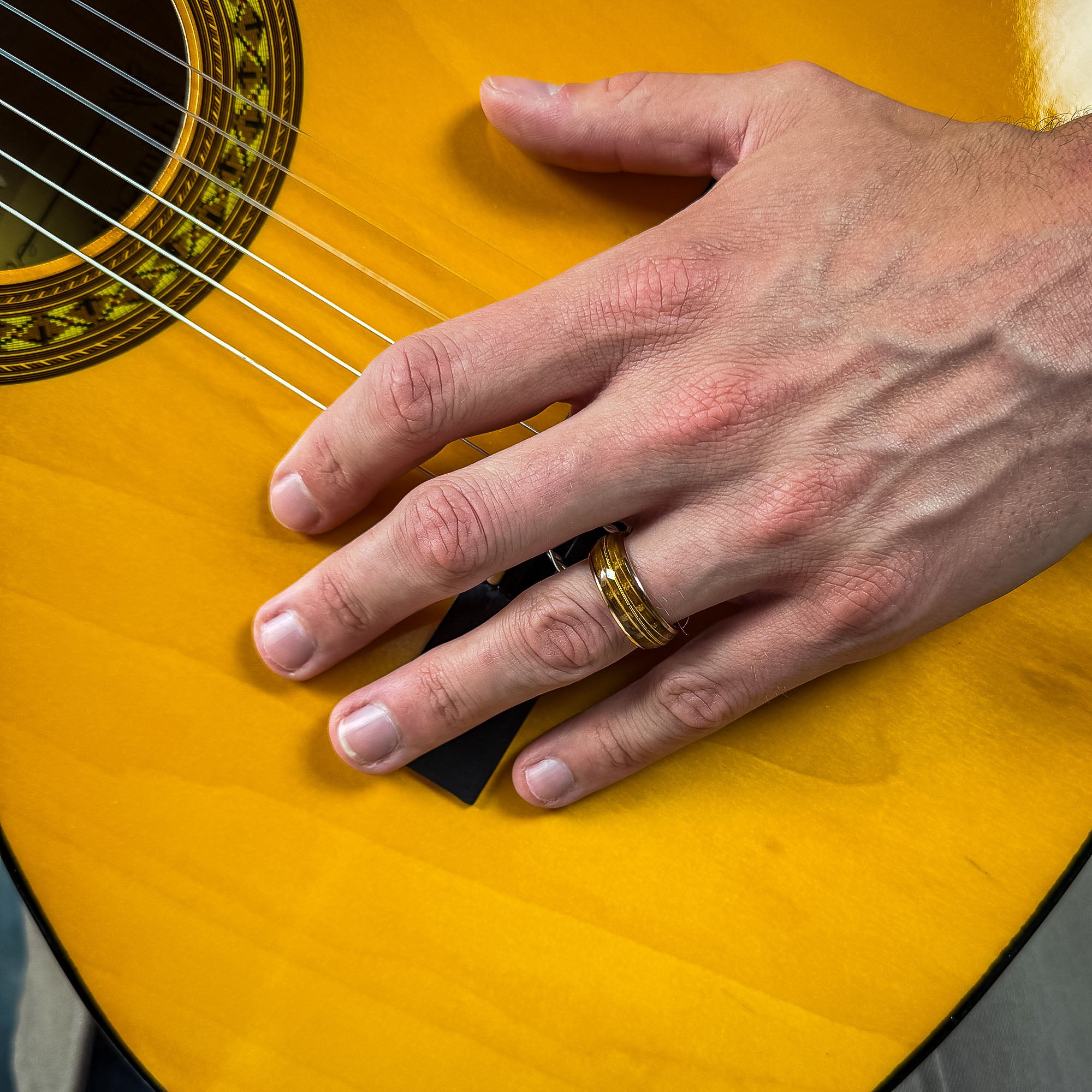 rose gold wedding band for him made with recycled guitar wood
