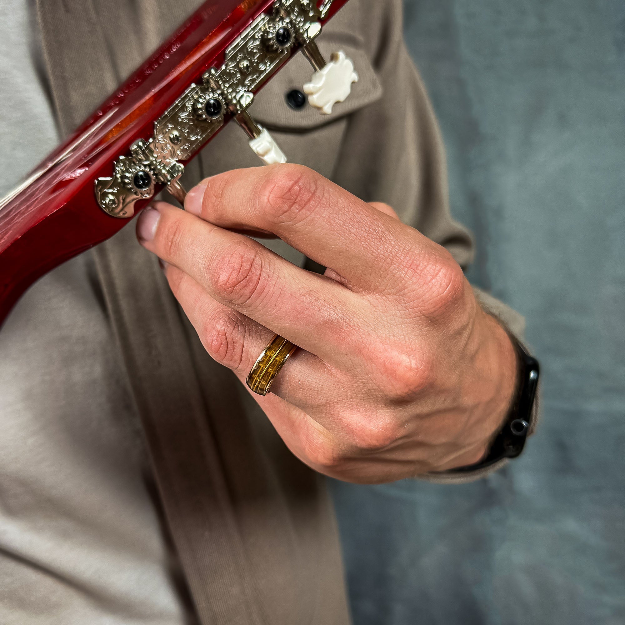 wood and rose gold men’s guitar string wedding ring