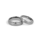 matching wedding bands tungsten set for couples on white background