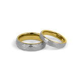 his and hers matching wedding bands silver and gold on white background