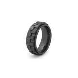 black spinning ring with gears for anxiety relief on white background