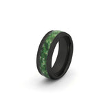 8mm black wedding ring featuring a moss agate inlay, photographed on a white background.