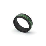 Elegant 8mm black wedding ring with unique moss agate detail, shown on a white surface.