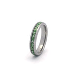 Women’s moss agate wedding ring with polished silver tungsten band on white background