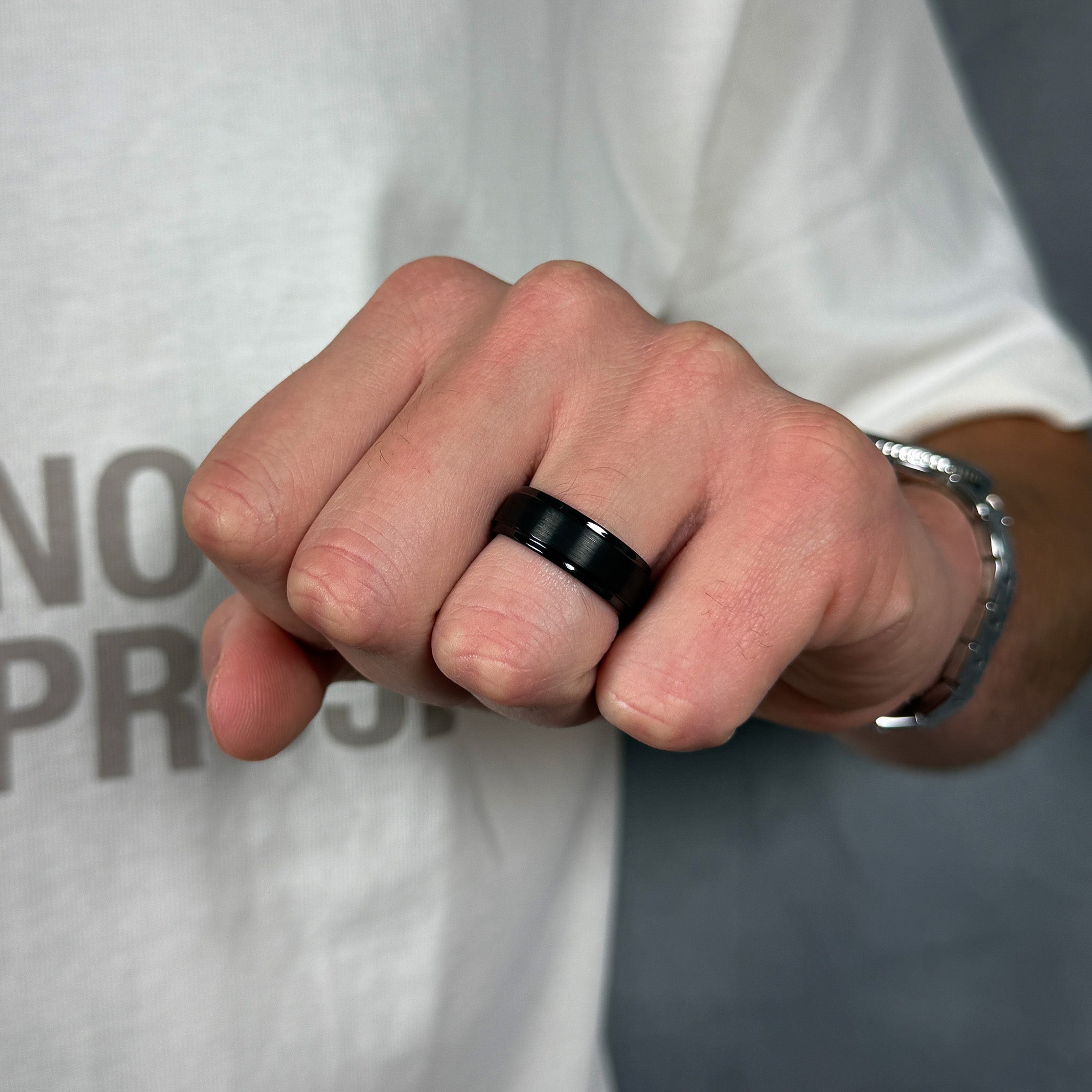 mens black brushed tungsten ring with polished stepped edges