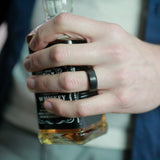 man wearing a tungsten wedding ring made from recycled whiskey barrels