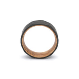 geometric pattern mens wedding ring with oak wood sleeve top view