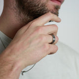 a man wearing a whiskey barrel and tungsten wedding ring
