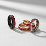 a lineup of coloured tungsten wedding bands with a vibrant turquoise inlay