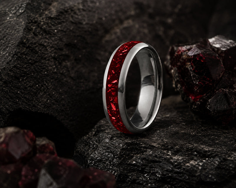 a lineup of coloured tungsten wedding bands with a vibrant turquoise inlay