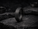 comfort fit wedding bands photographed on a natural stone background