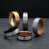 brushed tungsten rings photographed against a dark background