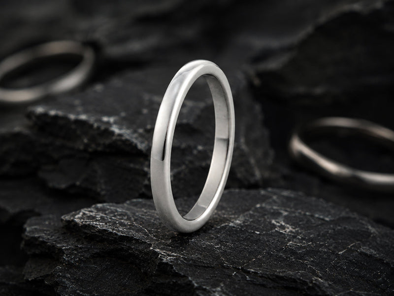 classic wedding bands photographed on a natural stone background