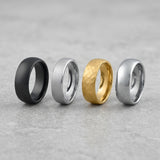 mens durable wedding bands lined up on a dark studio background
