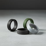 mens beveled silicone rings on a concrete surface