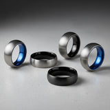 a collection of mens rounded titanium wedding bands