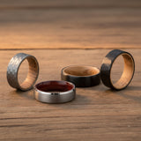 a collection of mens wedding bands made from tungsten and wood