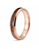 Angled view of a 4mm rose gold tungsten ring with a reddish-brown wood inlay.