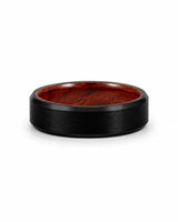 6mm brushed black tungsten wedding ring with polished edges and genuine whiskey wood sleeve lying flat on a white background.