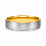 Brushed silver 6mm tungsten wedding ring with polished gold inner band lying flat on a white studio background