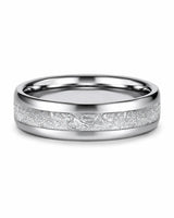 Flat view of a 6mm silver tungsten wedding ring with an imitated meteorite inlay and polished interior.