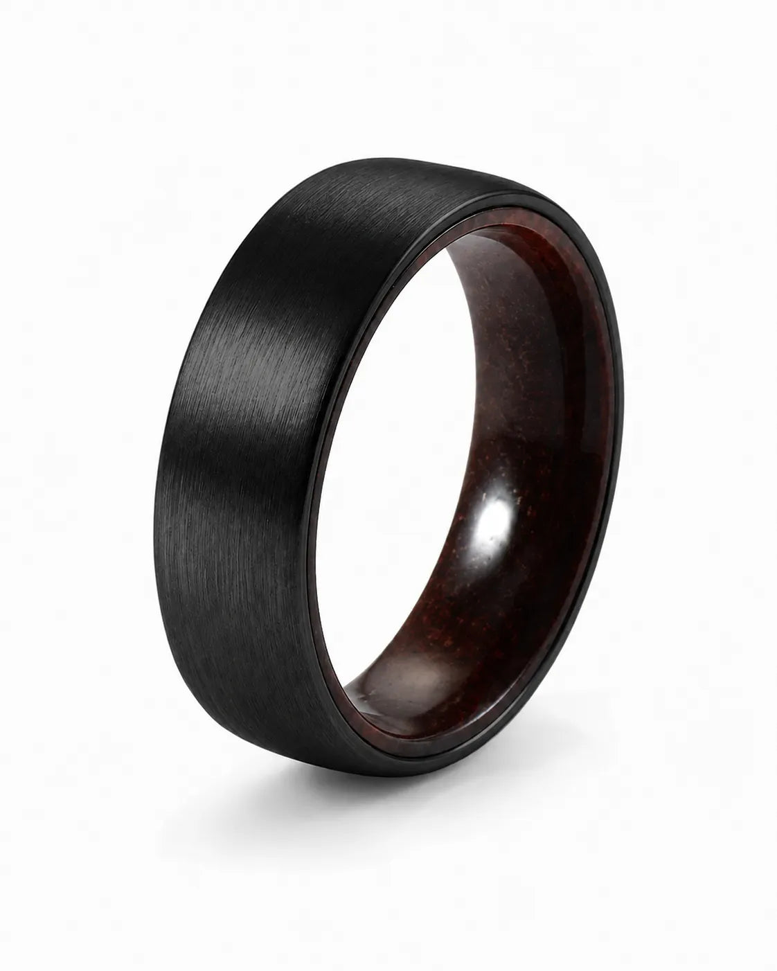 Brushed black tungsten wedding ring with a maple wood sleeve interior shown at an angled view on a white background.