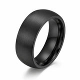 8mm brushed black tungsten men's wedding band with a matte brushed finish photographed at a 35 degree angle on a white background.