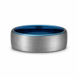 Brushed silver 8mm tungsten wedding ring with polished blue inner band lying flat on a white studio background