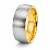 Brushed silver tungsten wedding ring with polished gold interior shown at an angle on a white background.