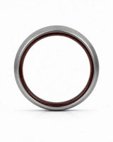 Side profile of a brushed silver tungsten wedding ring with a maple wood sleeve interior.