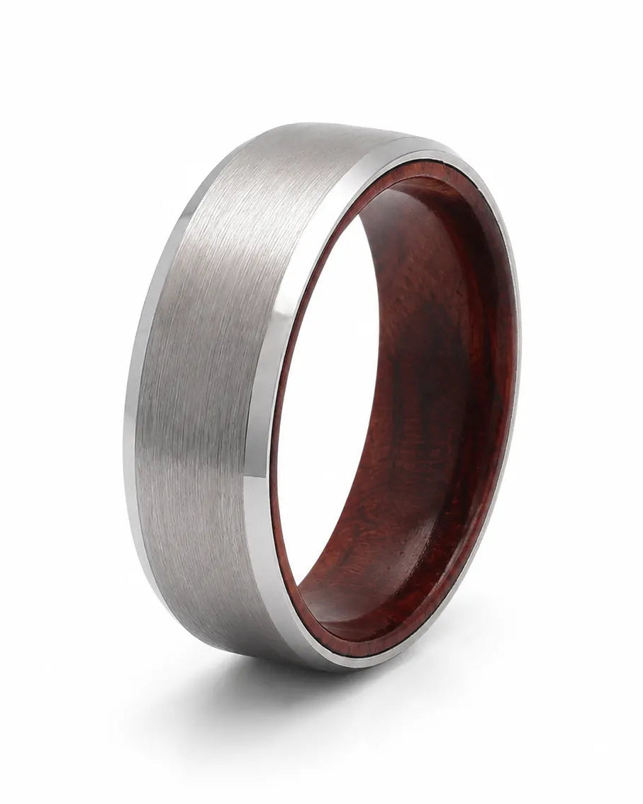 Angled view of an 8mm brushed silver tungsten ring with polished edges and maple wood sleeve interior