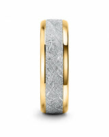 Angled view of 8mm gold tungsten wedding band with textured meteorite style centre and polished edges