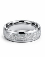 Angled view of 8mm silver tungsten wedding band with textured meteorite style centre and polished edges