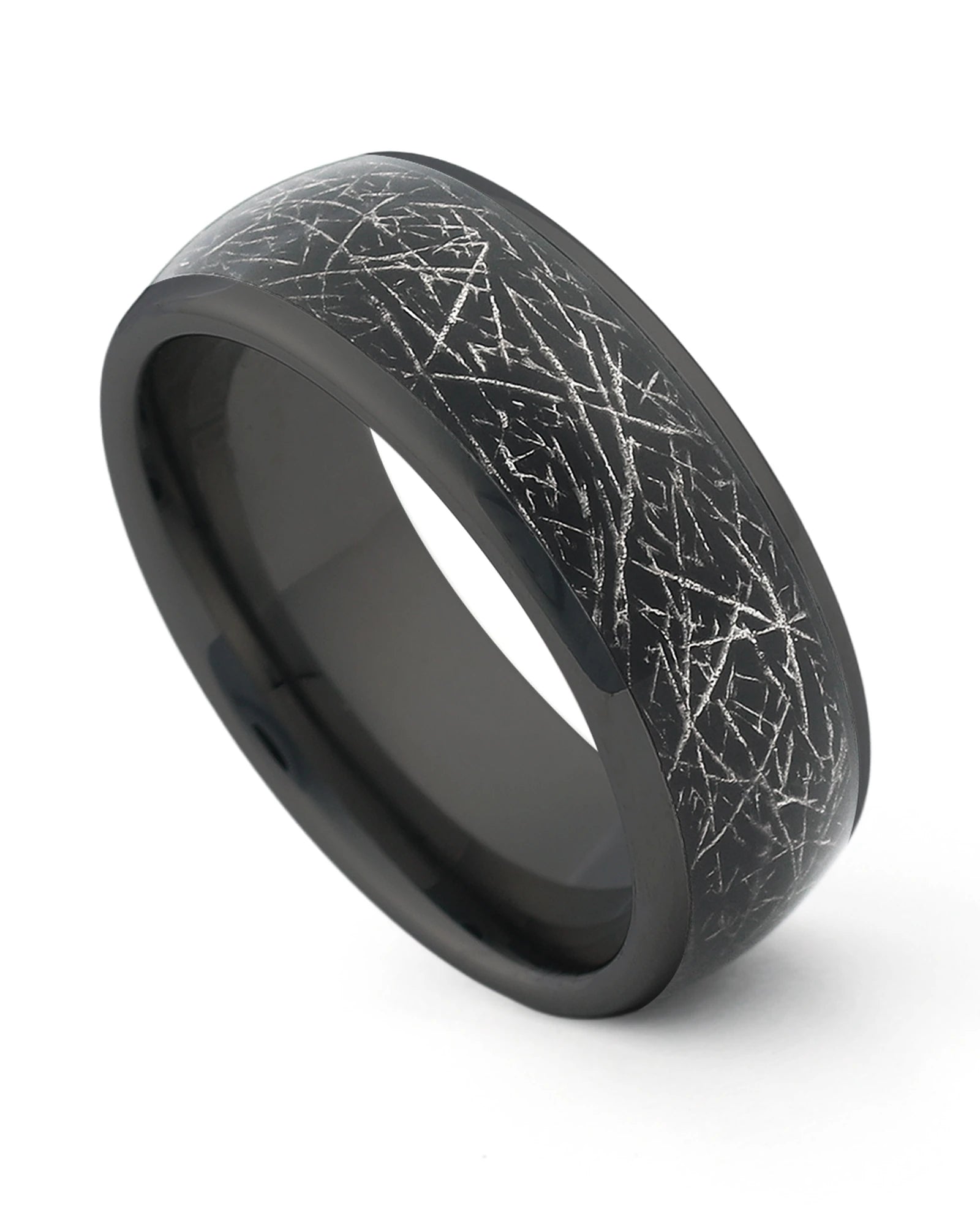 Black galaxy and meteorite tungsten ring shown at an angle