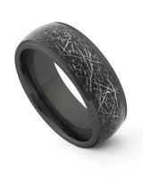 Black galaxy and meteorite tungsten ring shown at an angle