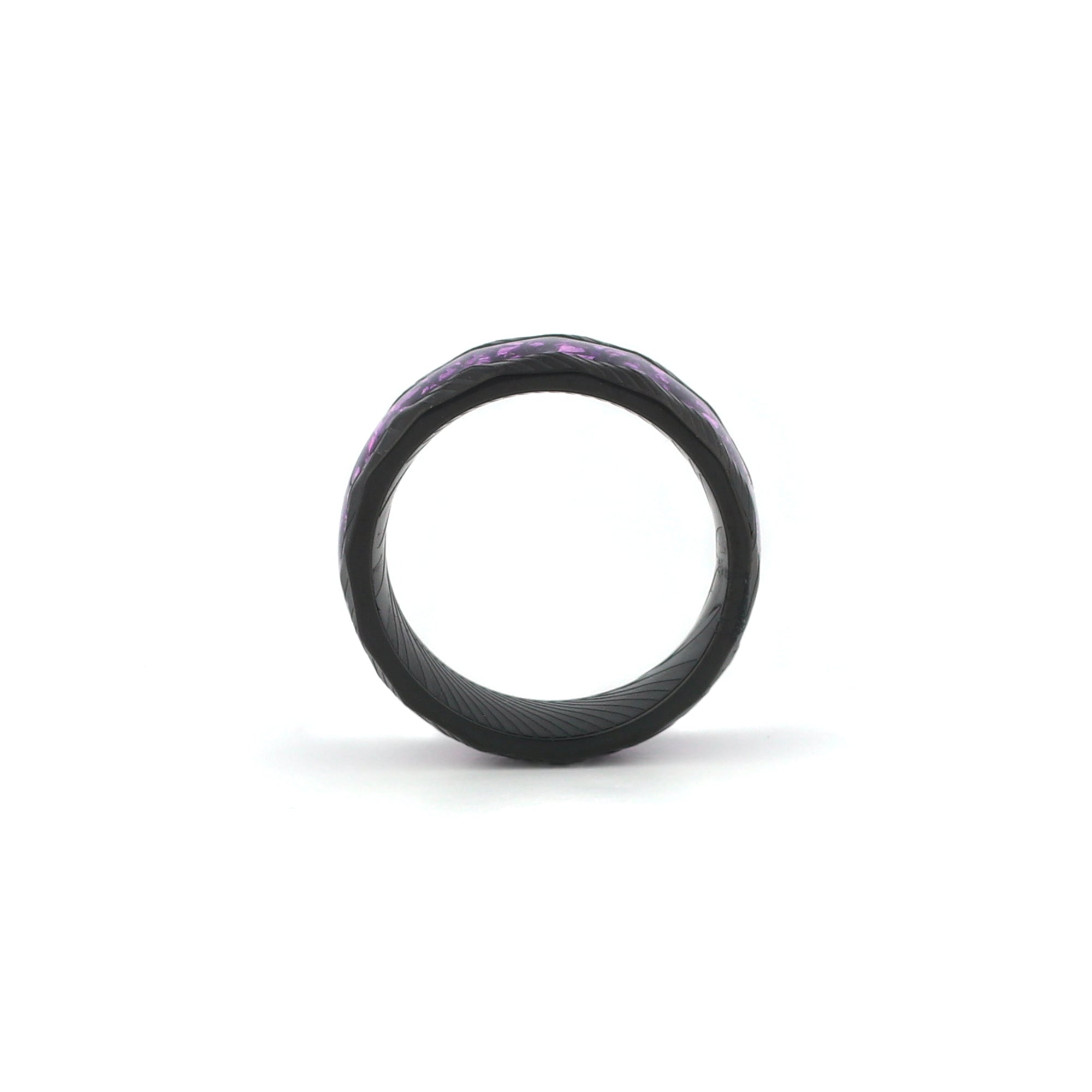 black wedding ring with purple amethyst inlay