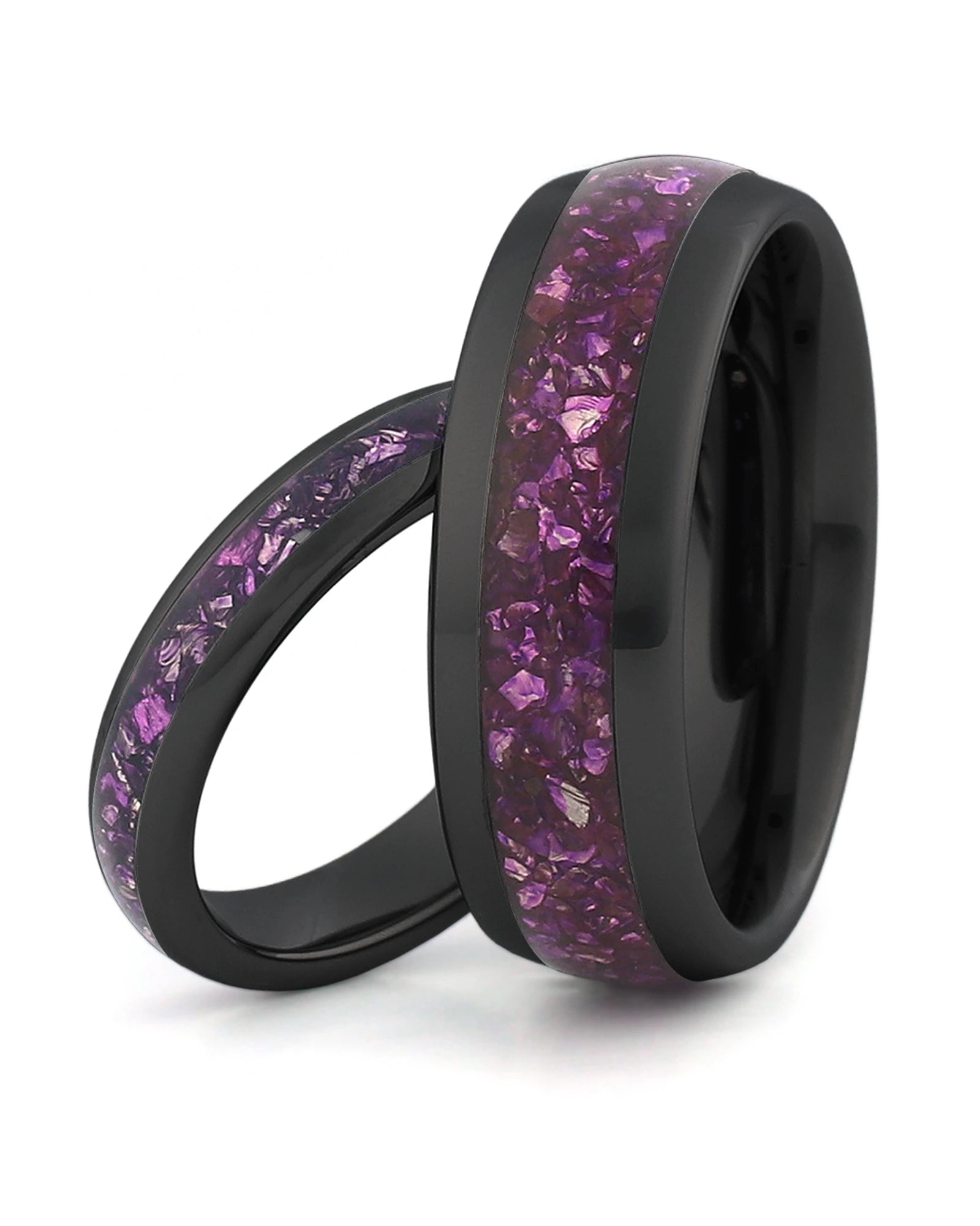 Matching black tungsten wedding rings with purple amethyst stone inlays