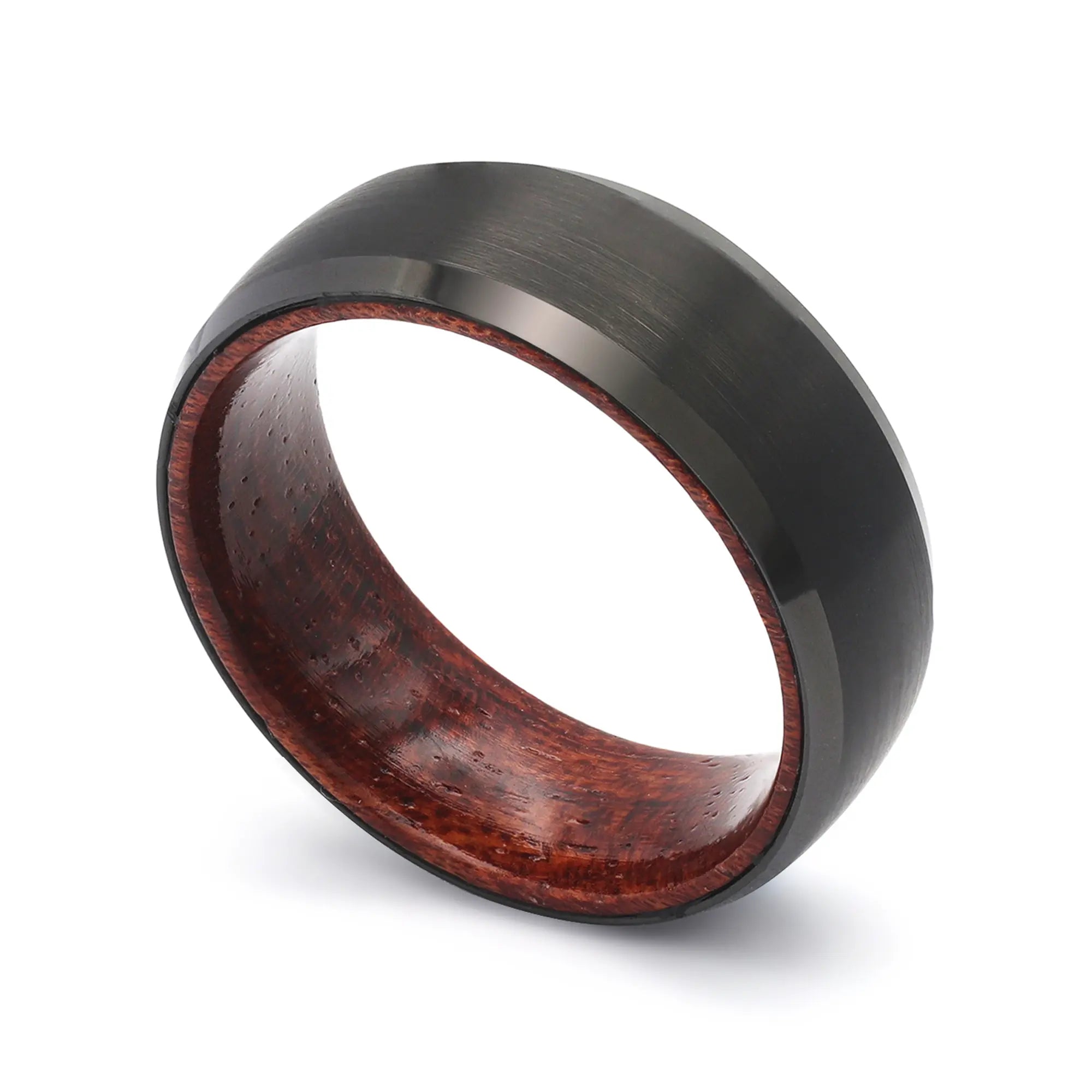 Angled view of a black beveled tungsten whiskey barrel wedding ring with a real maple wood interior.