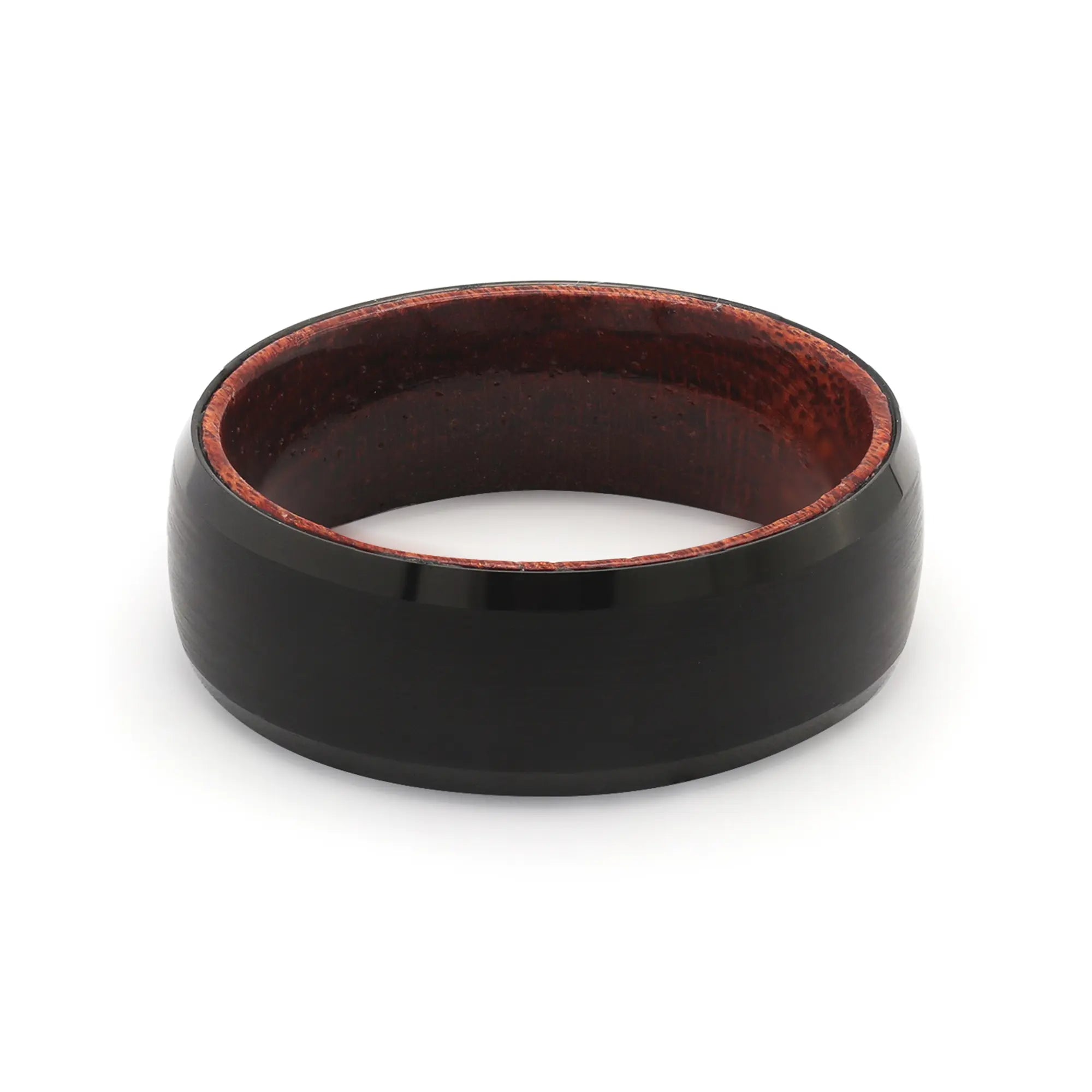 Top view of a black beveled tungsten wedding ring with a real maple whiskey barrel wood interior.