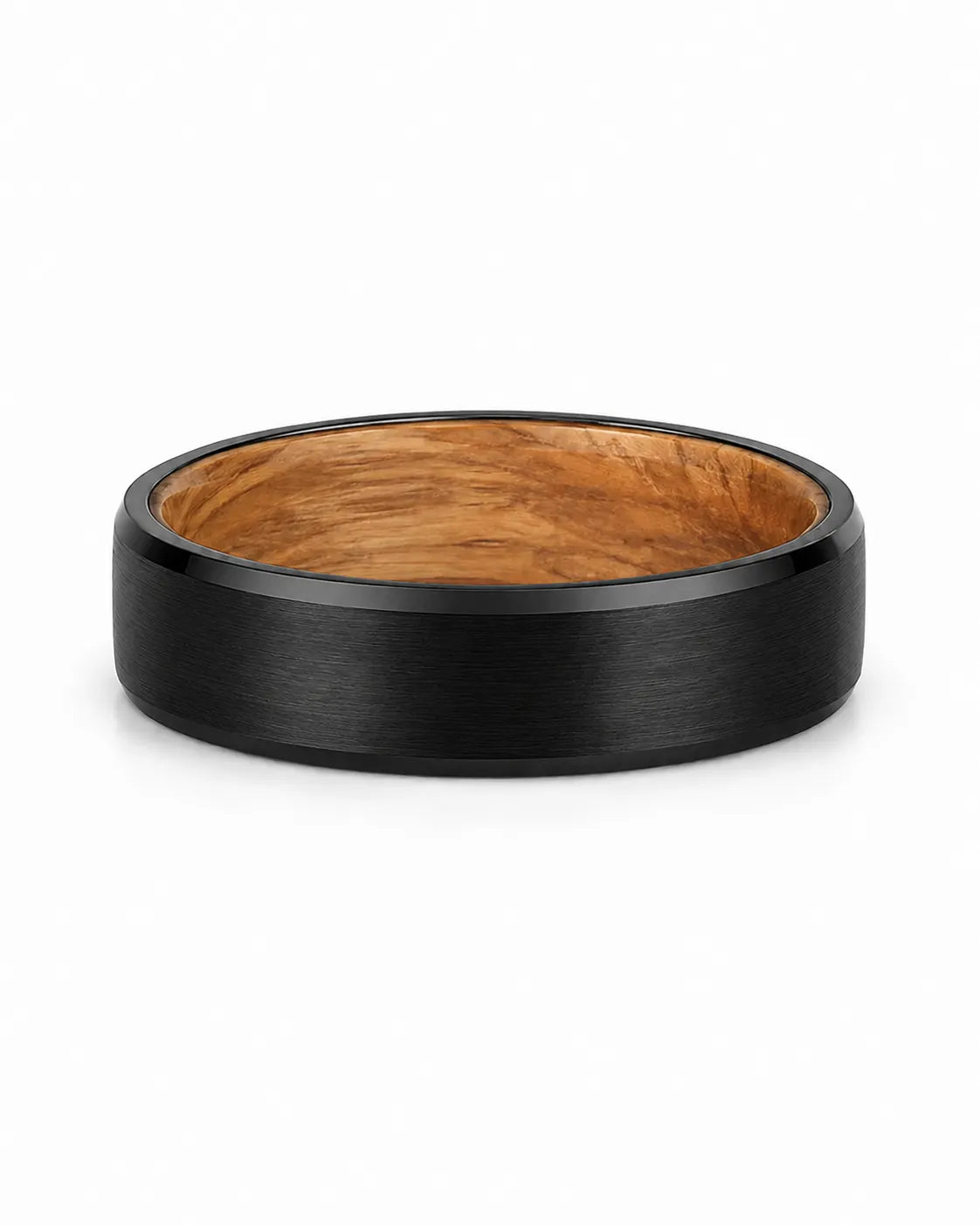 Black beveled tungsten wedding ring with whiskey barrel wood inner sleeve photographed from a low front angle on a white background.