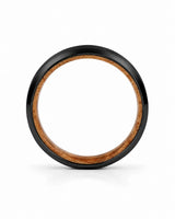 Side profile of a black beveled tungsten wedding ring with a whiskey barrel wood inner sleeve showing the band thickness.
