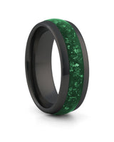 Black 8mm tungsten ring with green emerald inlay shown at an angle