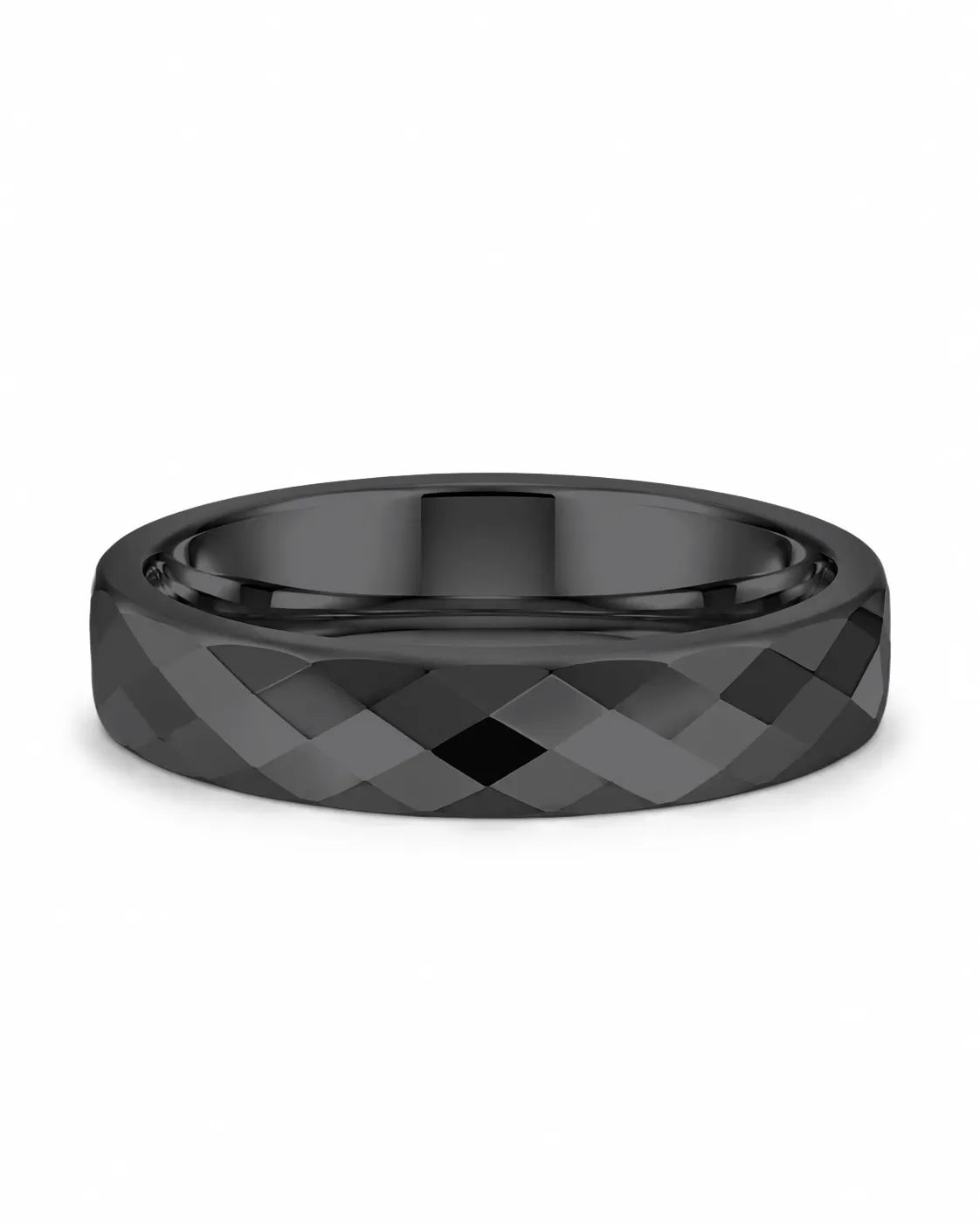 Black faceted tungsten wedding ring lying flat, showing the diamond-cut finish