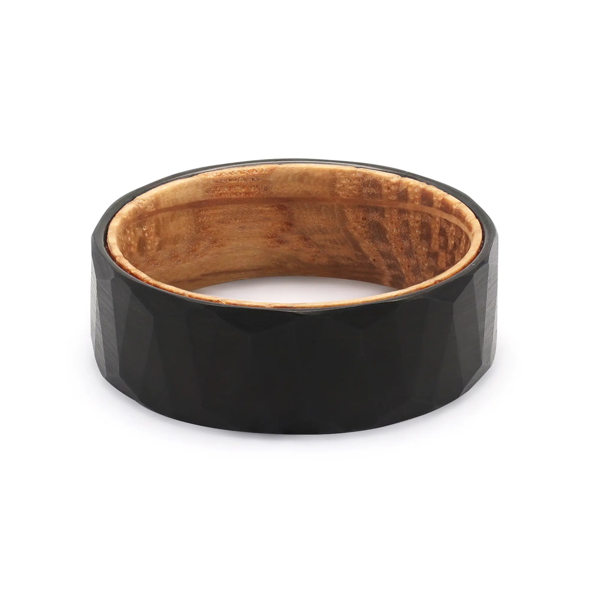 Top view of a black geometric tungsten wedding ring with a recycled whiskey barrel oak wood interior.