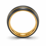Front view of a brushed black tungsten wedding ring with an asymmetric gold groove and polished gold comfort fit interior.