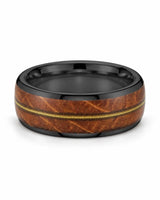 Black guitar string wedding band lying flat, showing the wood inlay and polished interior
