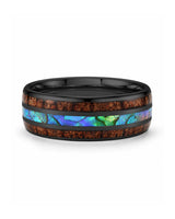 Koa wood and abalone shell tungsten ring lying flat showing the inlay detail
